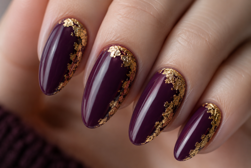 Deep plum nails with gold foil